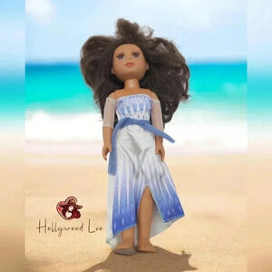 Battat 13 Inch fashion doll Plastic/Rubber wearing a Disney dress